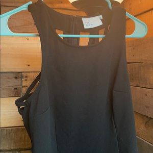 A black crossed back dress